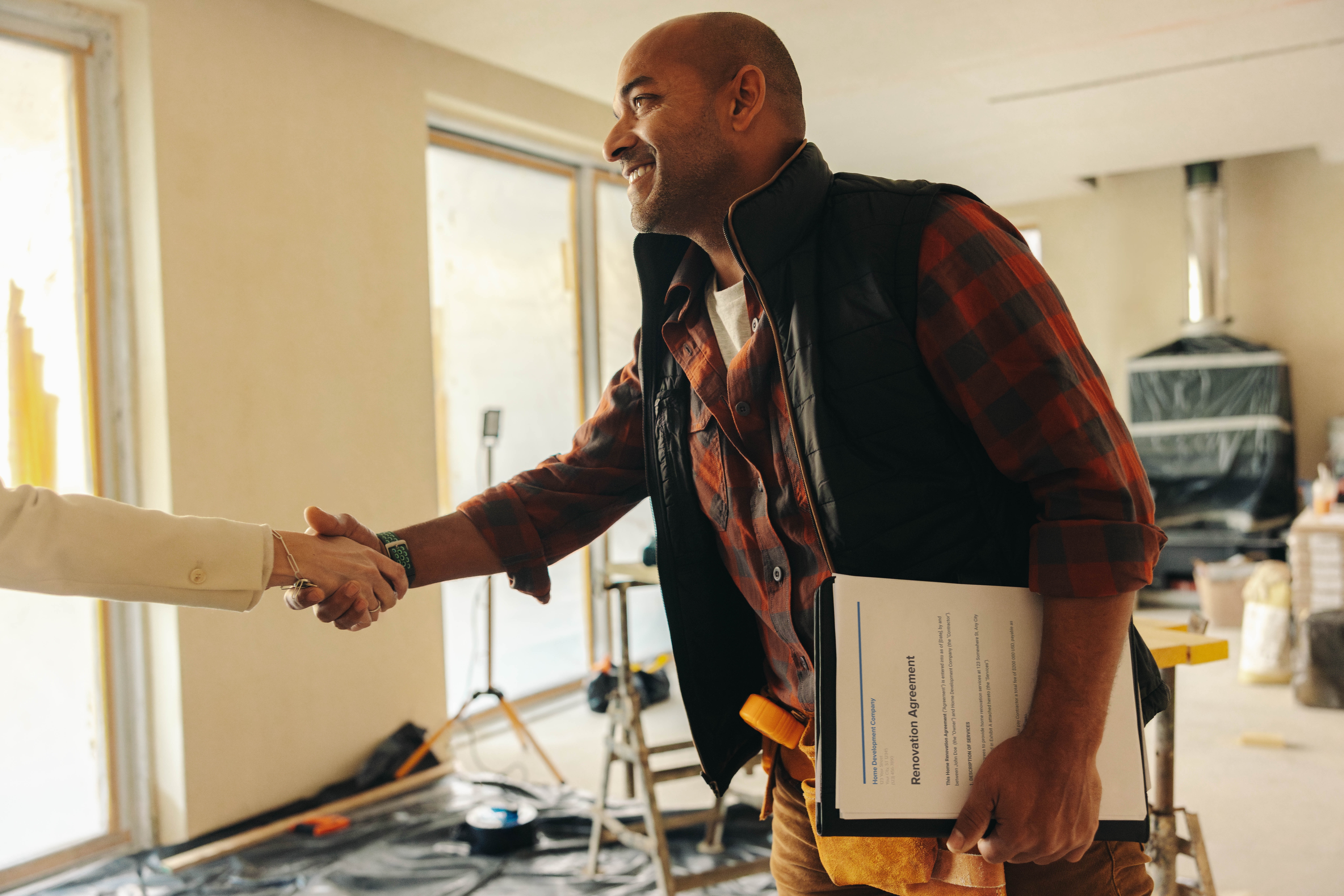 Contractor shaking hands with homeowner