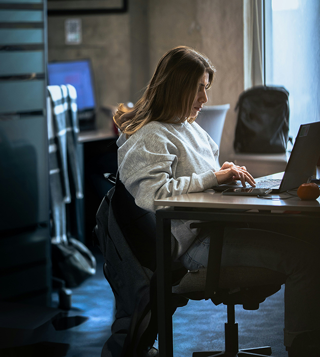 Nothing But Up featured image of women sitting at desk while looking at computer